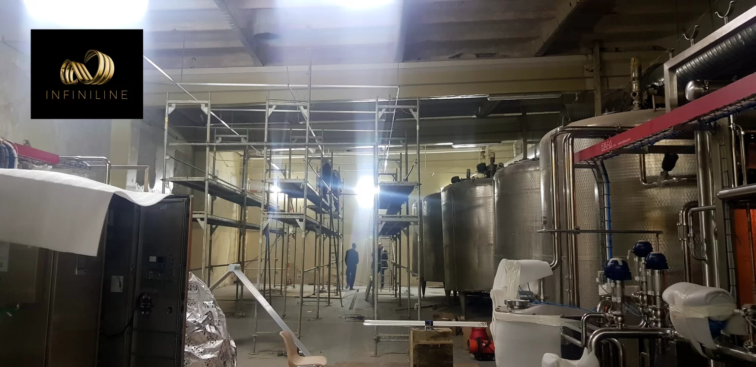 wykonane-prace-sufity-napinane-do-pomieszczen-produkcyjnych-fabryka-logo-6